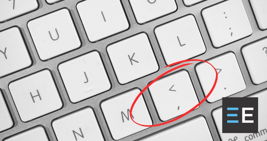 A keyboard with the comma key circled in red