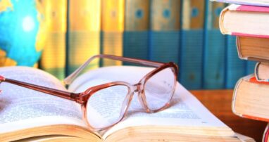 Glasses resting on an open book