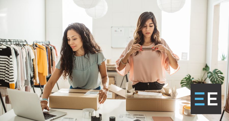 Two people packaging boxes