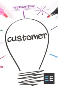 A hand drawn light bulb surrounded by colored text and markers. Inside the light bulb is the word customer